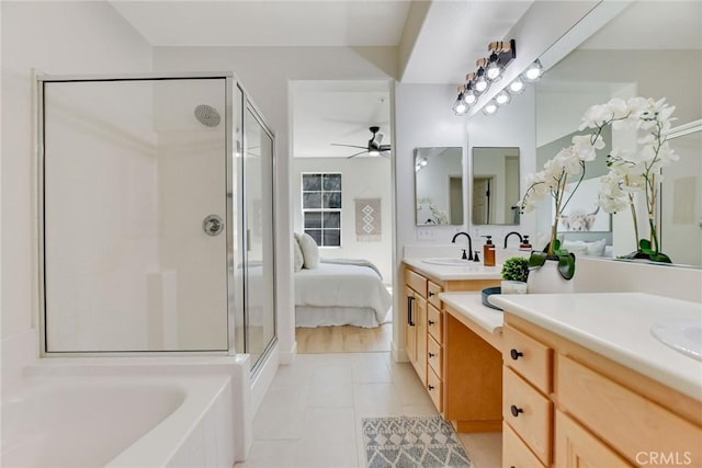 28210 Canterbury Ct, Valencia, CA 91354 - full bathroom with ceiling fan, a shower stall, vanity, a garden tub, and tile patterned floors