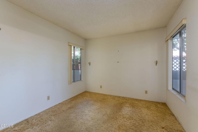 1742 Sinaloa Rd Unit 329, Simi Valley, CA 93065 - carpeted empty room with a textured ceiling
