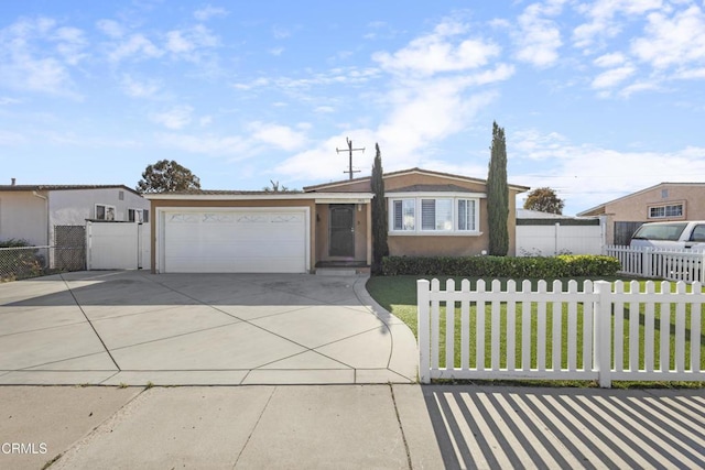 915 Maplewood Way, Port Hueneme, CA 93041 - view of front of house with concrete driveway, a garage, and stucco siding