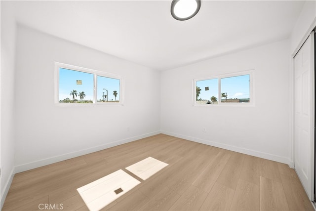 5832 6th Ave, Los Angeles, CA 90043 - unfurnished bedroom with light wood finished floors, baseboards, and a closet