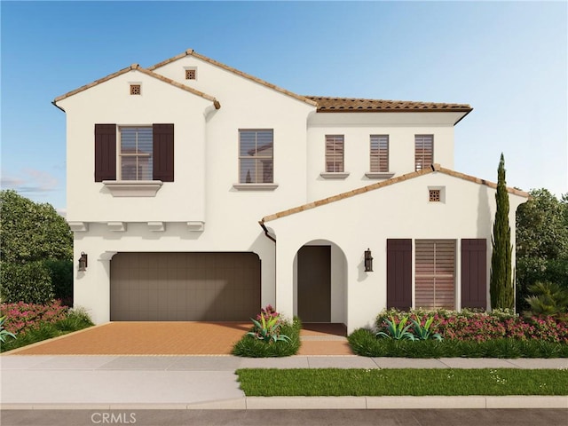 114 Oakstone, Irvine, CA 92618 - mediterranean / spanish home with stucco siding, an attached garage, a tiled roof, and decorative driveway