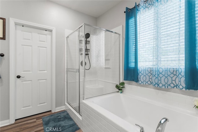 20793 Spring Mountain Rd, Riverside, CA 92507 - full bathroom with a stall shower, a garden tub, and wood finished floors