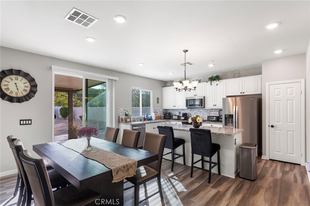 20793 Spring Mountain Rd, Riverside, CA 92507 - dining area with a chandelier, dark wood-type flooring, and recessed lighting