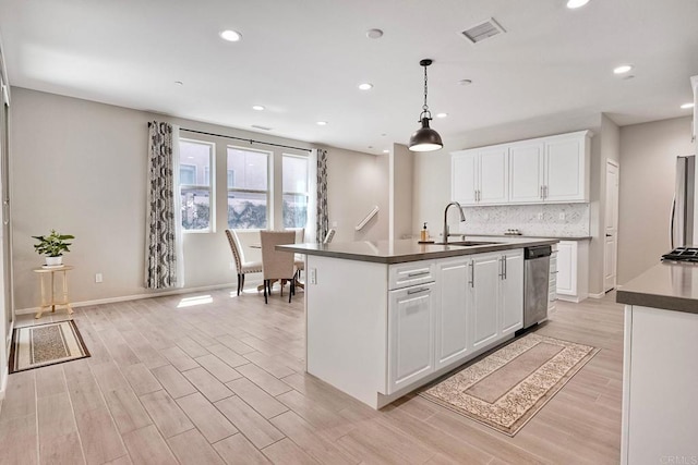 678 Gemstone Dr, San Marcos, CA 92078 - kitchen with a sink, dishwasher, dark countertops, white cabinetry, and recessed lighting
