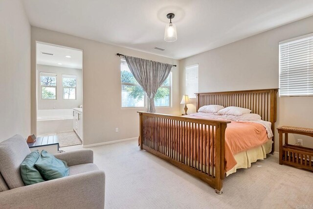 678 Gemstone Dr, San Marcos, CA 92078 - bedroom featuring light colored carpet, baseboards, and connected bathroom
