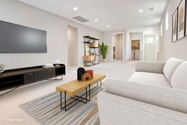 678 Gemstone Dr, San Marcos, CA 92078 - living room featuring washing machine and clothes dryer, light carpet, recessed lighting, and baseboards