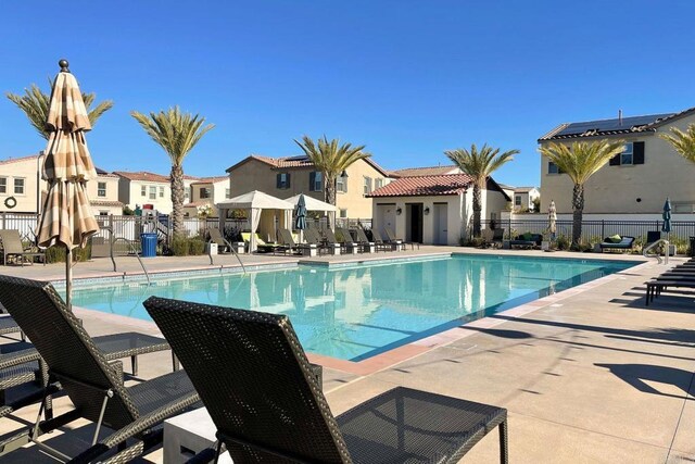 678 Gemstone Dr, San Marcos, CA 92078 - community pool with a residential view and a patio