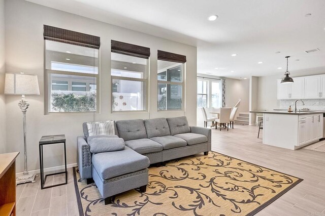 678 Gemstone Dr, San Marcos, CA 92078 - living area with light wood finished floors, recessed lighting, and baseboards