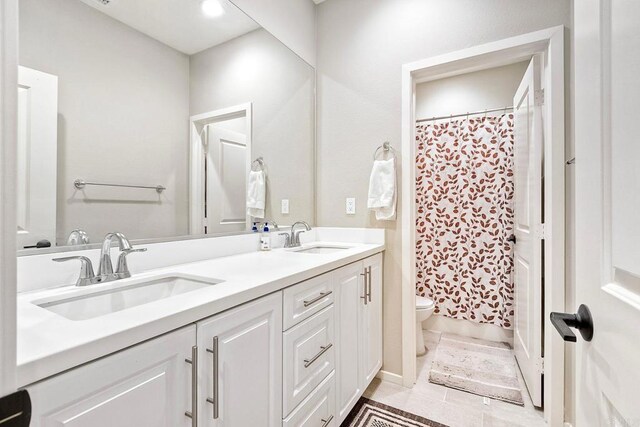 678 Gemstone Dr, San Marcos, CA 92078 - bathroom with toilet, double vanity, a shower with curtain, and tile patterned floors