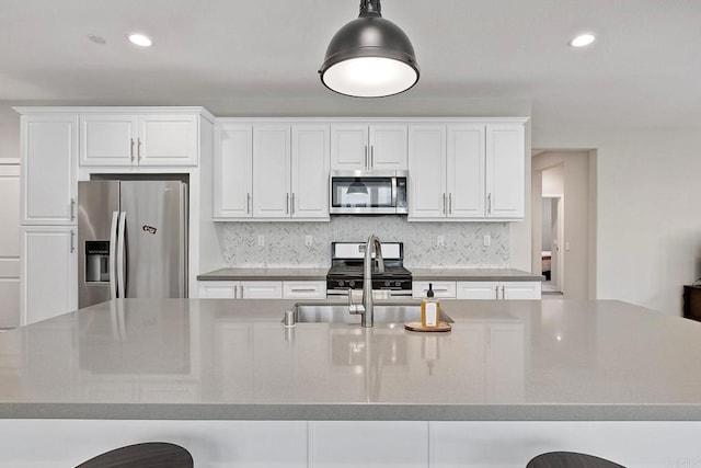 678 Gemstone Dr, San Marcos, CA 92078 - kitchen with appliances with stainless steel finishes, white cabinetry, backsplash, recessed lighting, and a sink