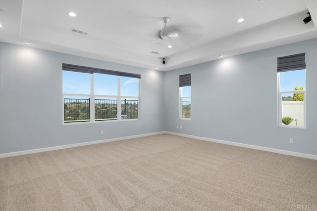 1733 Lemonadeberry Ln, Vista, CA 92084 - unfurnished room featuring a raised ceiling, recessed lighting, light colored carpet, and baseboards
