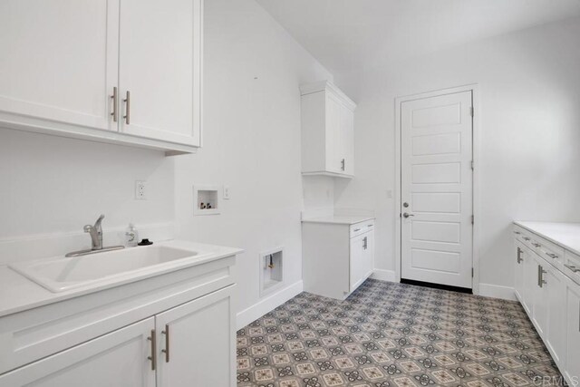 1733 Lemonadeberry Ln, Vista, CA 92084 - washroom with hookup for a washing machine, cabinet space, light flooring, and baseboards