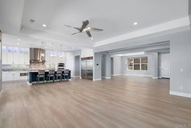 1733 Lemonadeberry Ln, Vista, CA 92084 - living area featuring ceiling fan, recessed lighting, baseboards, and light wood-type flooring