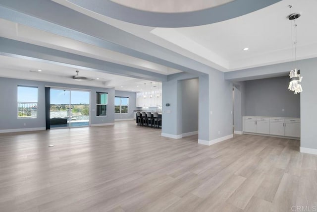 1733 Lemonadeberry Ln, Vista, CA 92084 - unfurnished living room featuring a chandelier, baseboards, light wood-style flooring, and recessed lighting