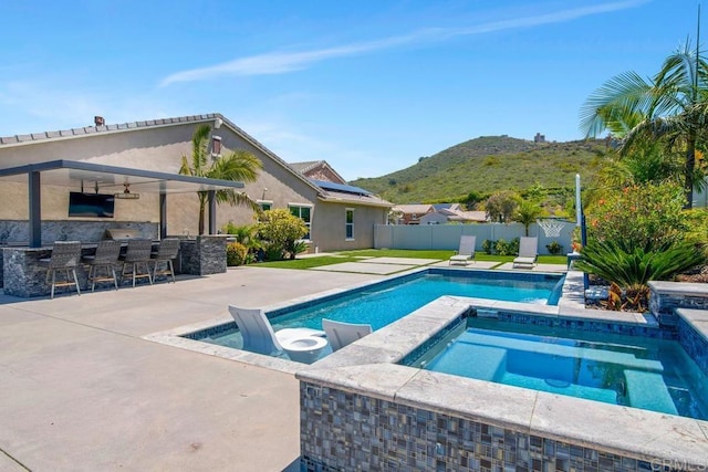 1733 Lemonadeberry Ln, Vista, CA 92084 - view of swimming pool featuring an in-ground hot tub, ceiling fan, a mountain view, a fenced backyard, and a patio area