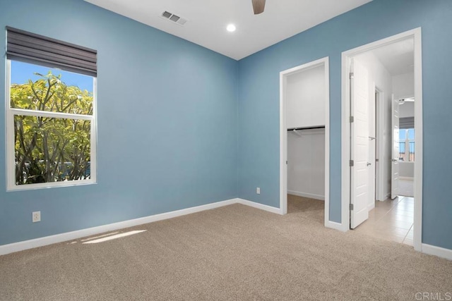 1733 Lemonadeberry Ln, Vista, CA 92084 - unfurnished bedroom with carpet flooring, baseboards, a walk in closet, recessed lighting, and ceiling fan