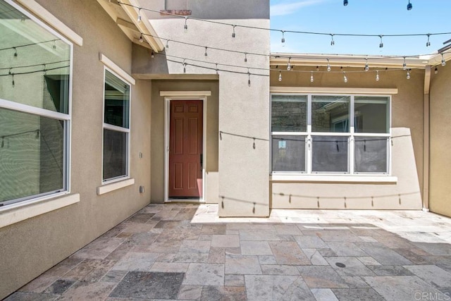 1733 Lemonadeberry Ln, Vista, CA 92084 - doorway to property featuring stucco siding and a patio