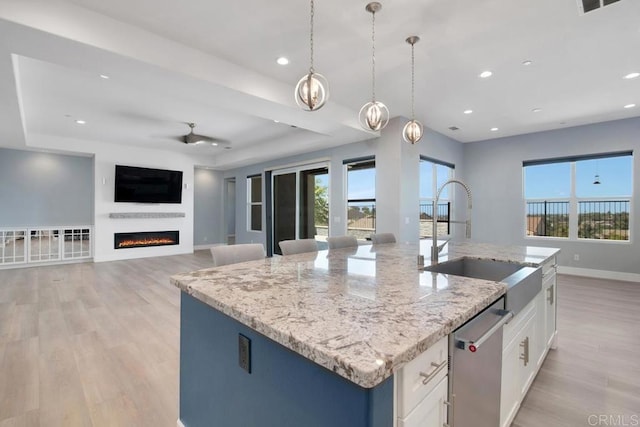 1733 Lemonadeberry Ln, Vista, CA 92084 - kitchen featuring dishwasher, healthy amount of natural light, an island with sink, light wood-type flooring, and recessed lighting