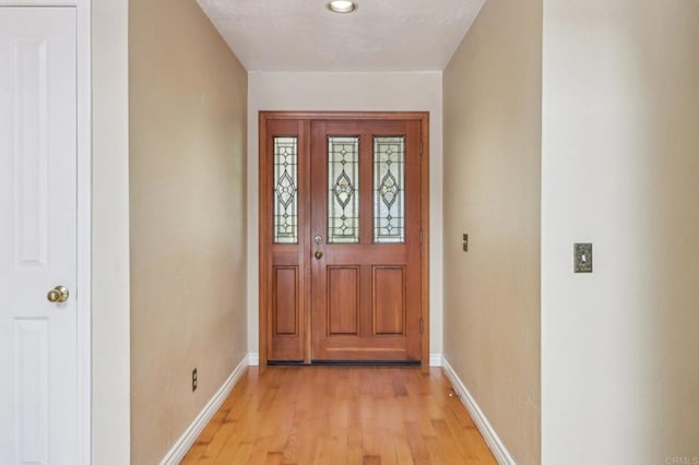 1575 Larson Ln, Fallbrook, CA 92028 - doorway to outside with baseboards and light wood-style flooring