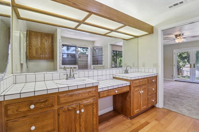 1575 Larson Ln, Fallbrook, CA 92028 - kitchen featuring a sink, tile countertops, brown cabinets, and plenty of natural light