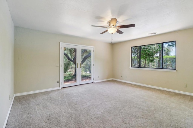 1575 Larson Ln, Fallbrook, CA 92028 - spare room featuring carpet flooring, a ceiling fan, baseboards, and french doors