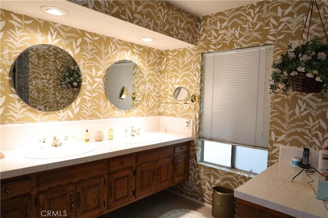 10035 Gierson Ave, Chatsworth, CA 91311 - full bathroom featuring wallpapered walls, double vanity, and recessed lighting