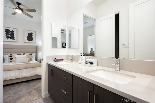 56217 Platinum Way, La Quinta, CA 92253 - ensuite bathroom with double vanity, a ceiling fan, and tile patterned flooring