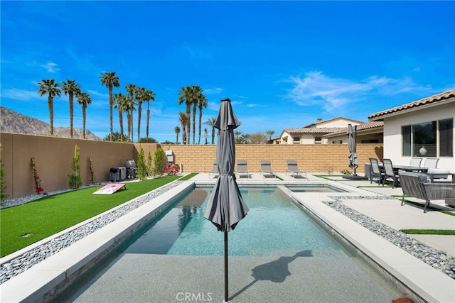 56217 Platinum Way, La Quinta, CA 92253 - view of pool featuring a fenced backyard, a patio, and a pool with connected hot tub