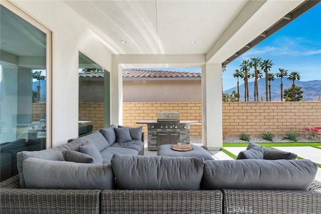 56217 Platinum Way, La Quinta, CA 92253 - view of patio with an outdoor living space, a mountain view, and a grill