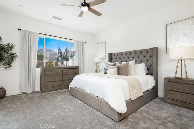 56217 Platinum Way, La Quinta, CA 92253 - carpeted bedroom with baseboards, a mountain view, and a ceiling fan