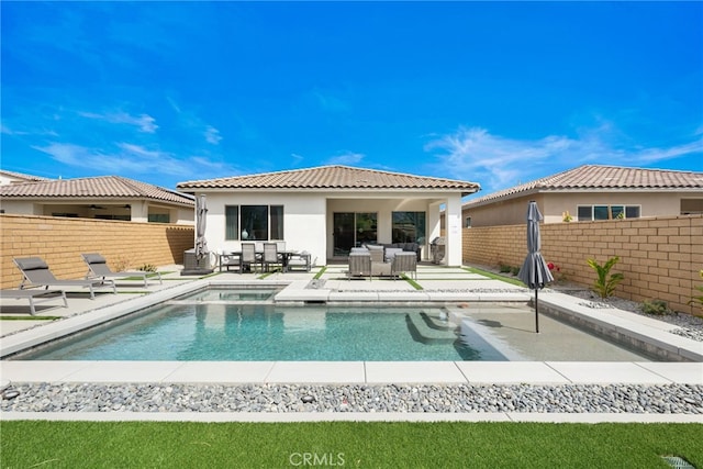 56217 Platinum Way, La Quinta, CA 92253 - rear view of property featuring an outdoor living space, a fenced backyard, stucco siding, and a patio area