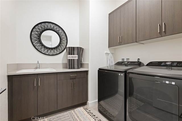 56217 Platinum Way, La Quinta, CA 92253 - laundry room featuring washer and dryer and cabinet space