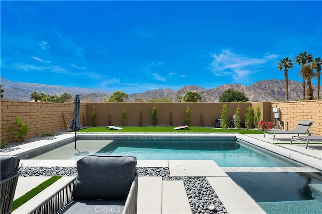 56217 Platinum Way, La Quinta, CA 92253 - view of swimming pool with a mountain view and a fenced backyard