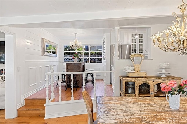 230 Esplanade, San Clemente, CA 92672 - dining room featuring a chandelier, beamed ceiling, and wood-type flooring