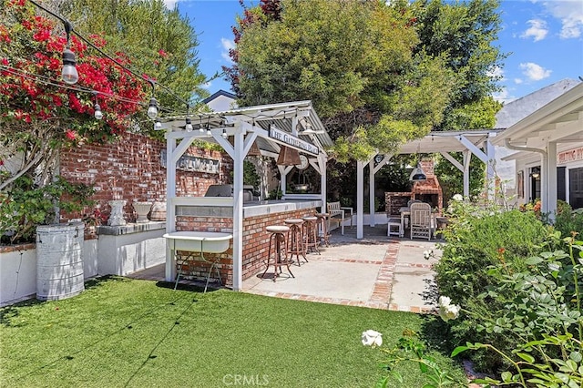 230 Esplanade, San Clemente, CA 92672 - view of patio / terrace with an outdoor fireplace and a pergola