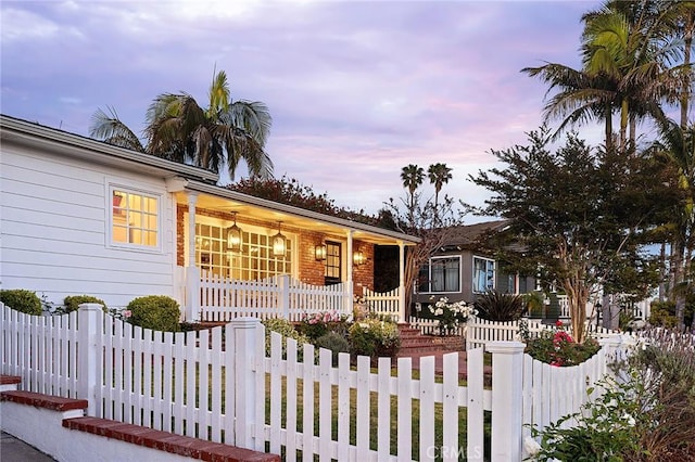 230 Esplanade, San Clemente, CA 92672 - ranch-style house with a porch and a fenced front yard
