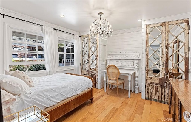 230 Esplanade, San Clemente, CA 92672 - bedroom with a chandelier and light wood-style flooring