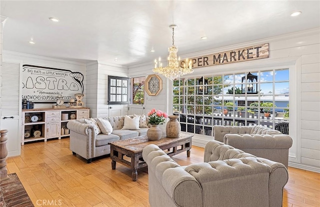 230 Esplanade, San Clemente, CA 92672 - living area featuring light wood finished floors, a chandelier, ornamental molding, healthy amount of natural light, and recessed lighting