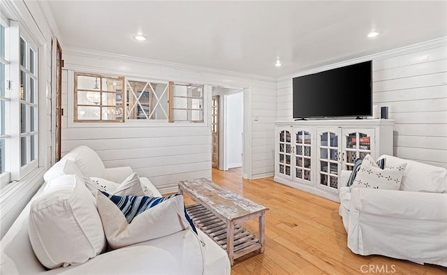 230 Esplanade, San Clemente, CA 92672 - living room featuring crown molding, light wood-style floors, plenty of natural light, wood walls, and recessed lighting