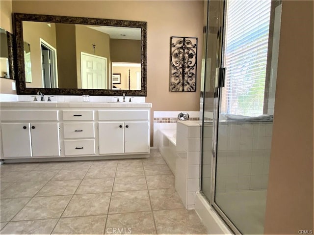 27951 Via De Costa, San Juan Capistrano, CA 92675 - full bathroom featuring double vanity, a garden tub, a shower stall, and tile patterned floors