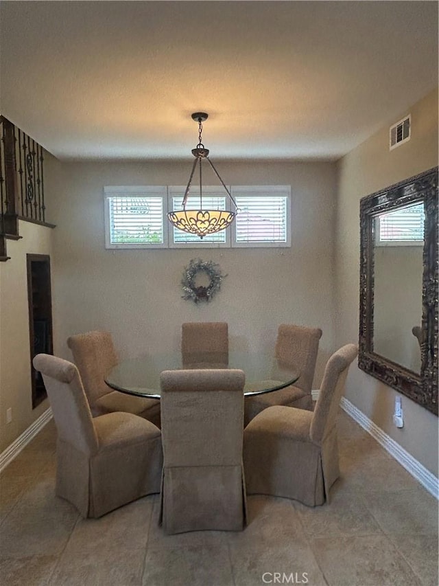 27951 Via De Costa, San Juan Capistrano, CA 92675 - dining space with plenty of natural light, light tile patterned floors, baseboards, and a chandelier