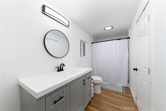 38448 95th St E, Palmdale, CA 93591 - bathroom featuring vanity, wood finished floors, toilet, and a shower with curtain
