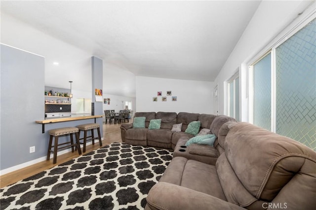 38448 95th St E, Palmdale, CA 93591 - living room with wood finished floors, lofted ceiling, plenty of natural light, and baseboards
