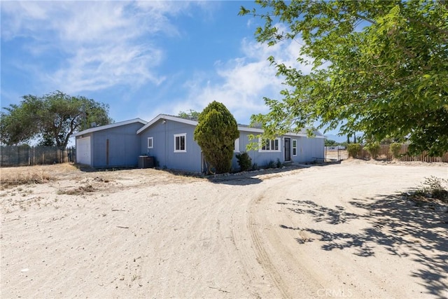 38448 95th St E, Palmdale, CA 93591 - view of front of house featuring cooling unit and a garage
