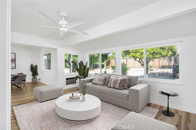 28870 Crosby Dr, Menifee, CA 92586 - living area featuring healthy amount of natural light, wood finished floors, a ceiling fan, and baseboards