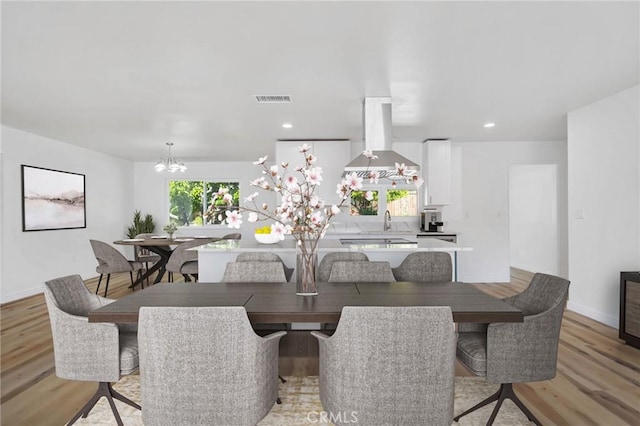 28870 Crosby Dr, Menifee, CA 92586 - dining space featuring a chandelier, light wood-style floors, recessed lighting, and baseboards