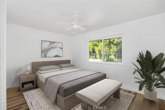 28870 Crosby Dr, Menifee, CA 92586 - bedroom featuring baseboards, wood finished floors, and a ceiling fan