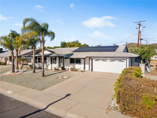 28870 Crosby Dr, Menifee, CA 92586 - ranch-style home featuring a garage, roof mounted solar panels, and concrete driveway