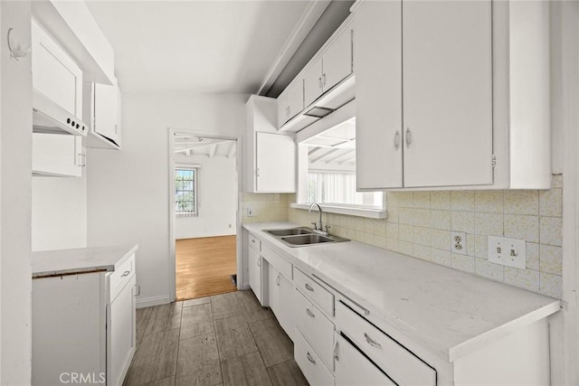 2517 S 2nd Ave, Arcadia, CA 91006 - kitchen featuring white cabinets, a sink, backsplash, and light countertops