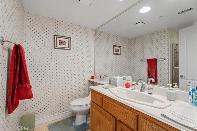 29206 Alfieri St, Laguna Niguel, CA 92677 - full bathroom with wallpapered walls, vanity, toilet, and a shower with shower door
